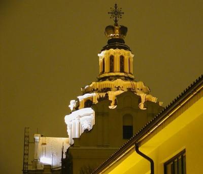 At night, the churches of central Vilnius take on a special charm in the glow of light from the adjacent streets. This is the famous steeple of St. Casimir's Church, a structure that is undergoing an extensive and quite successful renovation. 