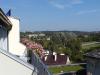 There are many interesting views from apartments in Vilnius, especially in Old Town.  Some are long views like this. Others are of nearby rooftops. Steeples figure prominently. And there are street scenes and views of interesting buildings. 