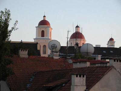 An attractive rooftop view, with interesting hints of the very old and the new. Red tile roofs predominate in central Vilnius. 